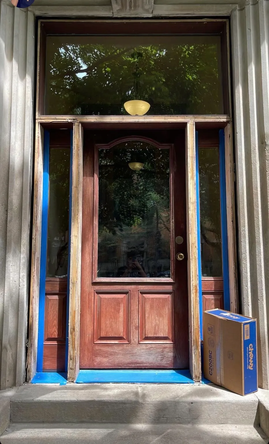 Prepared residential entry with protected edges during finish work
